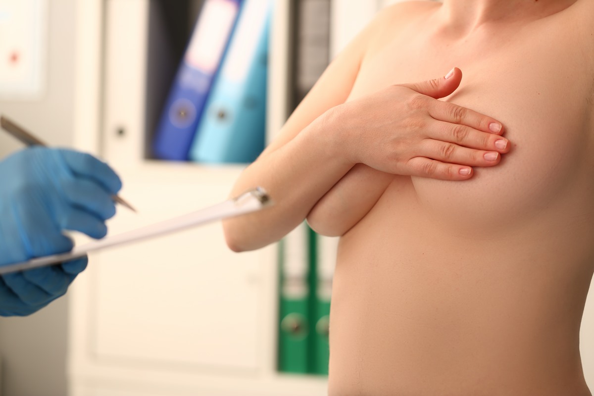 Woman's breasts causing her such 'excruciating pain' she has to