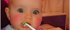When do you start brushing a baby's teeth?